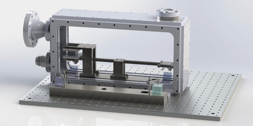 Figure 4. The nano-Newton torsion balance can be seen within the vacuum chamber below. The balance utilises a highly compliant torsional spring to support the balance beam, the angular displacement of which is measured using a phase shifting homodyne angu